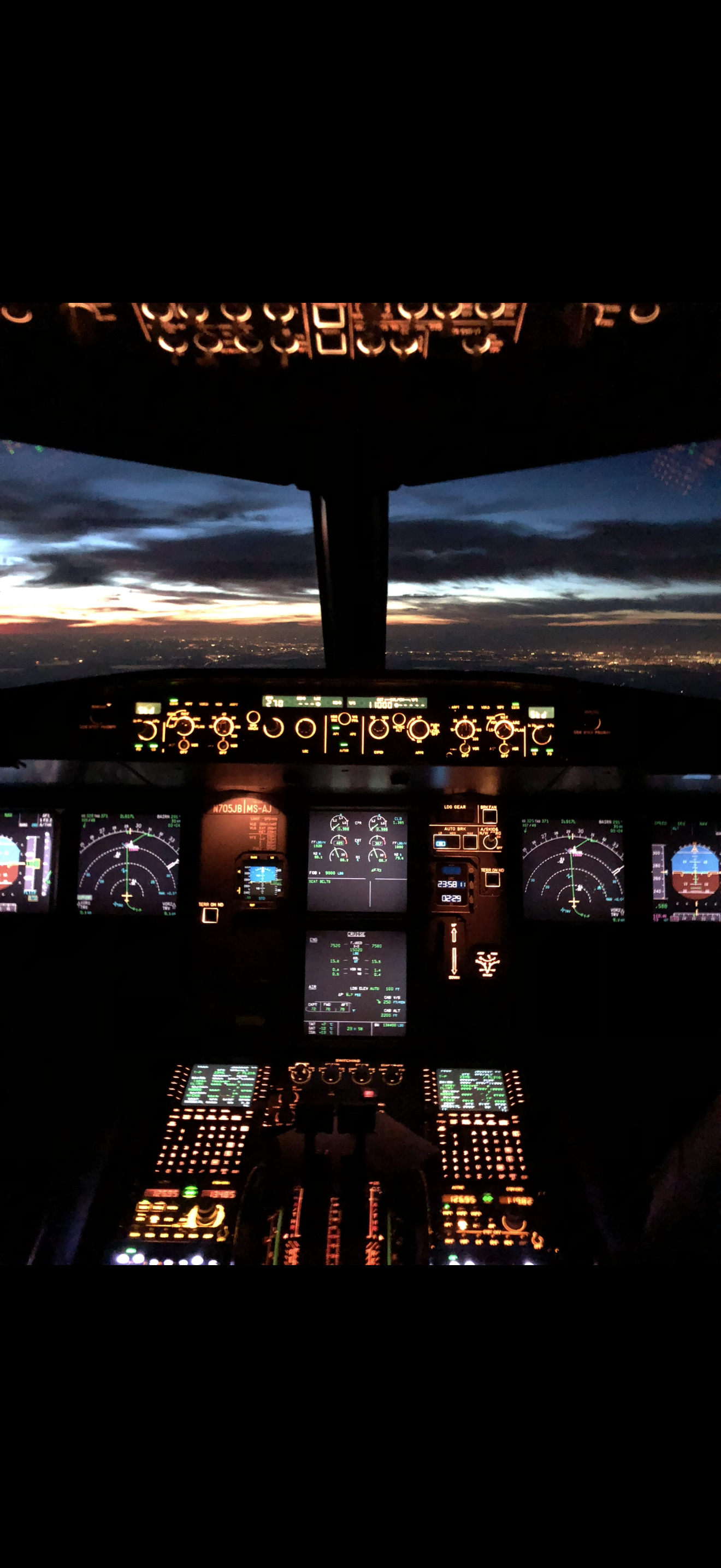 Airline captain in cockpit during golden hour
